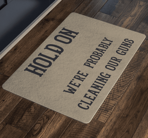 Image of Hold On - We're Probably Cleaning Our Guns Doormat