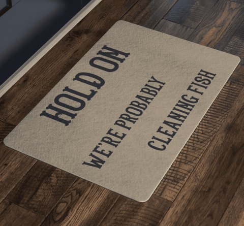 Image of Hold On We're Probably Cleaning Fish | Solid Color Background Doormat