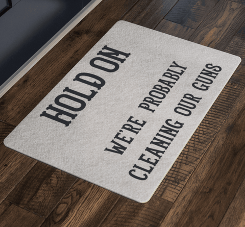 Image of Hold On - We're Probably Cleaning Our Guns Doormat