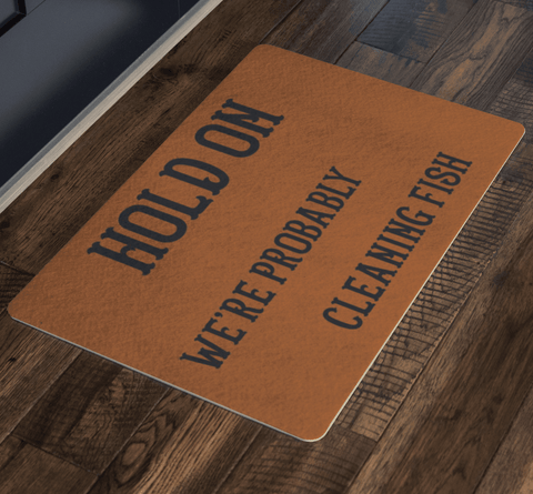 Image of Hold On We're Probably Cleaning Fish | Solid Color Background Doormat