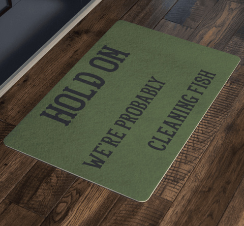 Image of Hold On We're Probably Cleaning Fish | Solid Color Background Doormat 