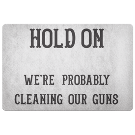 Hold On - We're Probably Cleaning Our Guns Doormat White 