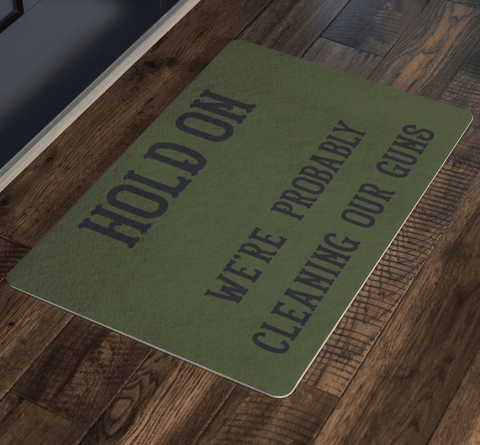 Image of Hold On - We're Probably Cleaning Our Guns Doormat 