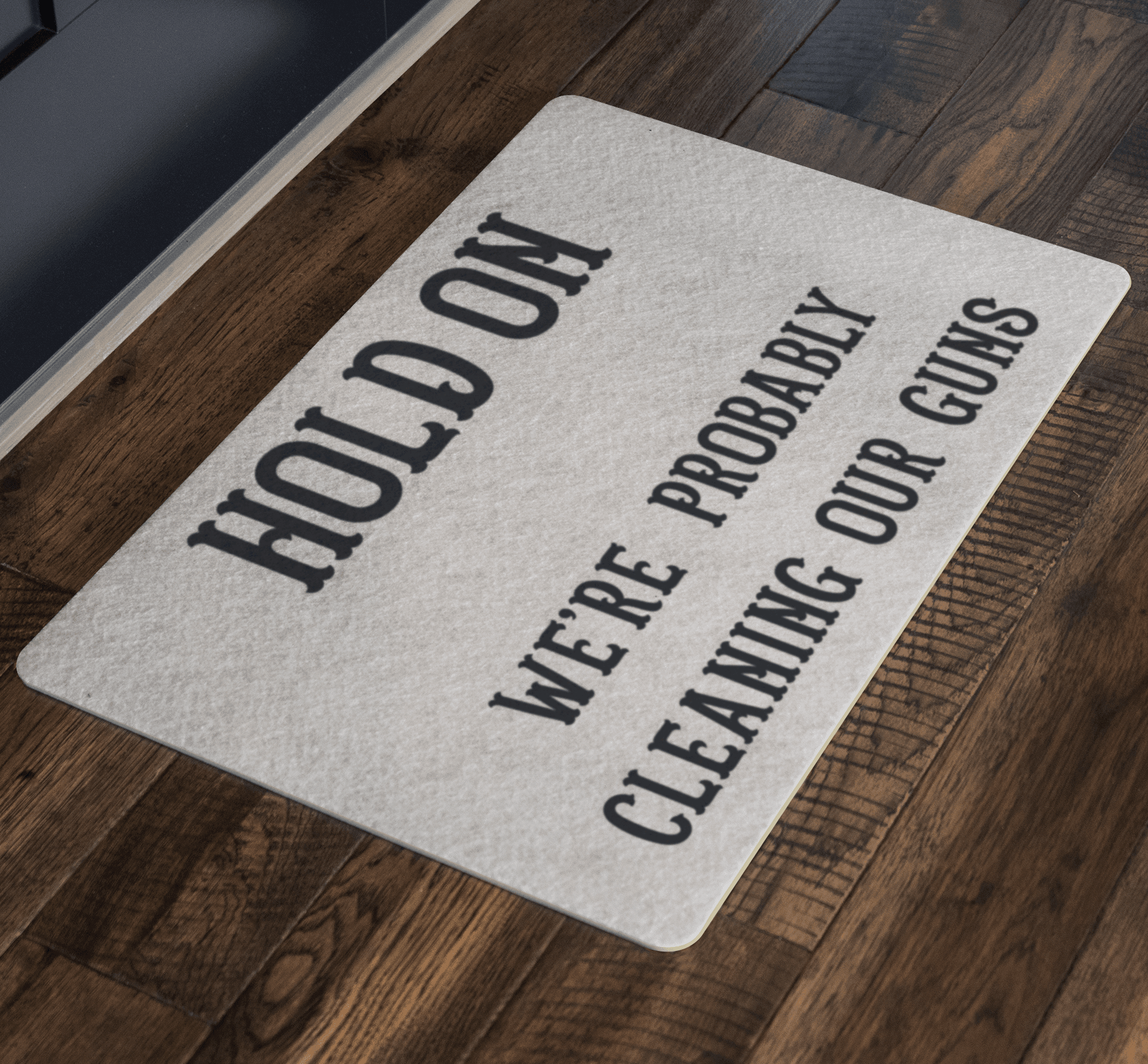 Hold On - We're Probably Cleaning Our Guns Doormat 